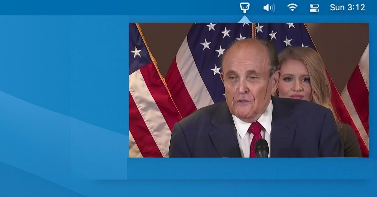 Man with bloody face at press conference