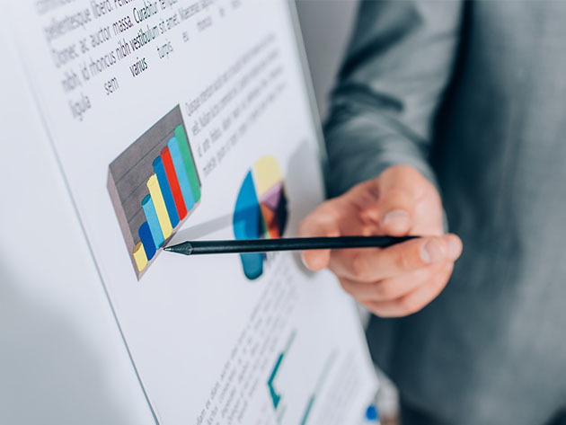 Person pointing with a pen on a chart